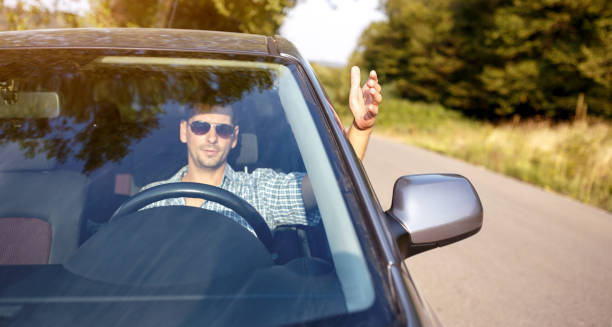 istock Angry driver is driving a car and shouting 849951602