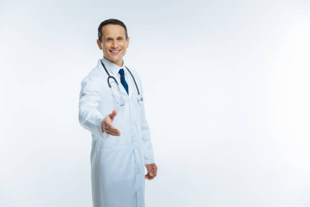 Friendly looking medical worker welcoming you over background