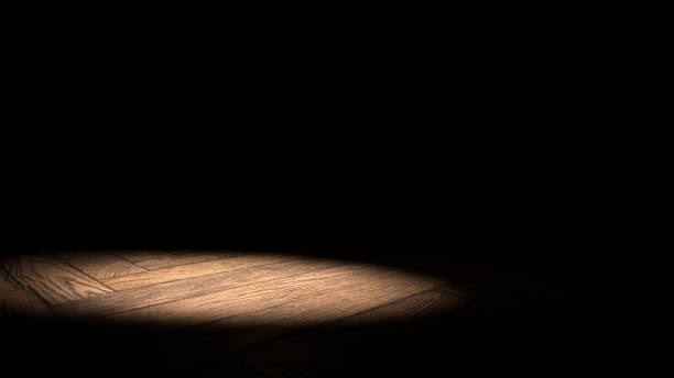 istock spotlight on wooden stage floor with black background 849970164