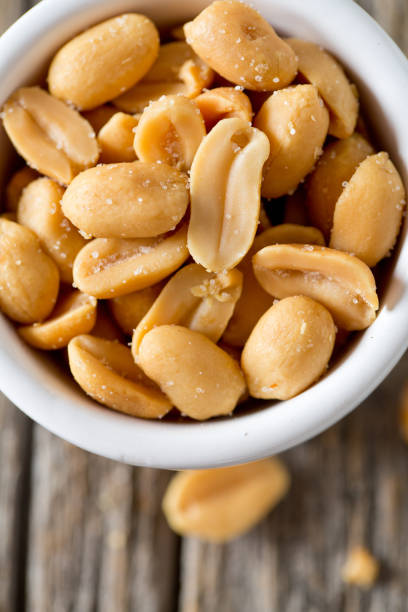 istock salted roasted peanuts in a bowl 849992678