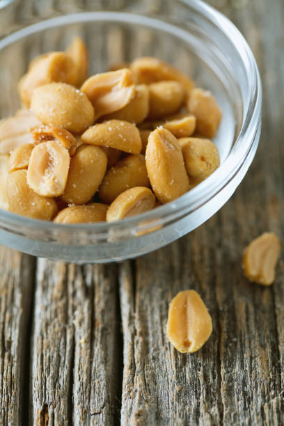 istock salted roasted peanuts in a bowl 849992696