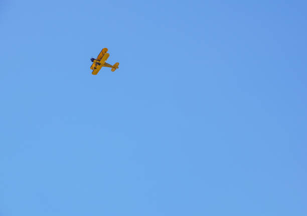 istock vintage airplane in flight . at empty blue sky 850001116