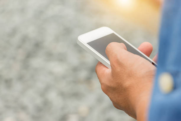 istock Close up of Engineering Businessman in blue jeans using mobile smartphone blurry background. 850024204