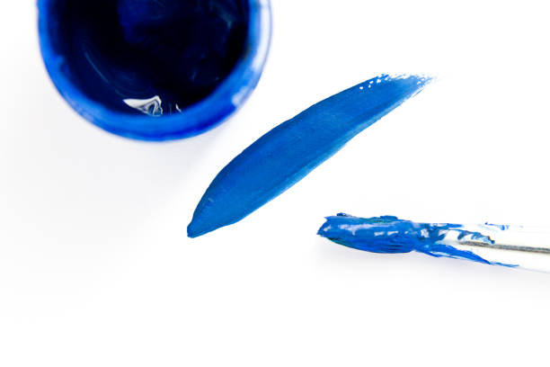 istock Smears with a blue paint brush on white paper. Gouache 850048712