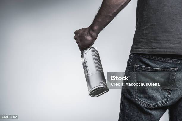 Young Man Has Alcohol Addiction Stock Photo - Download Image Now - Back, Bottle, Holding