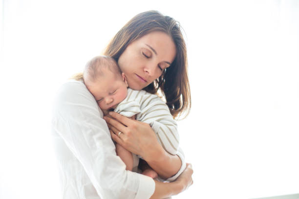 istock Young mother, holding her newborn baby boy 850113166