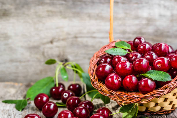 istock Organic cherries, farm fresh fruits on farmer table 850121180