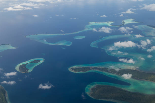 Solomon Islands Aerial View Aerial view photograph of small islands in the Solomon Islands. atoll photos stock pictures, royalty-free photos & images