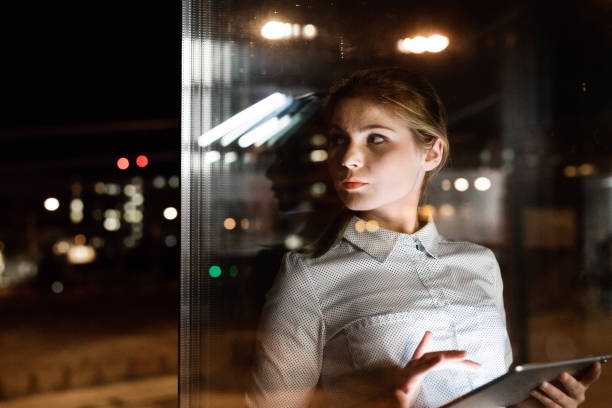 istock Businesswoman with tablet working late at night. 850124850