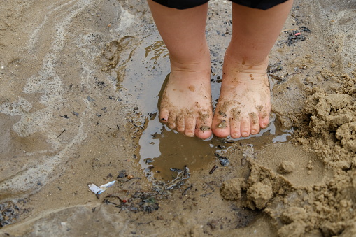 Child's feet in mud