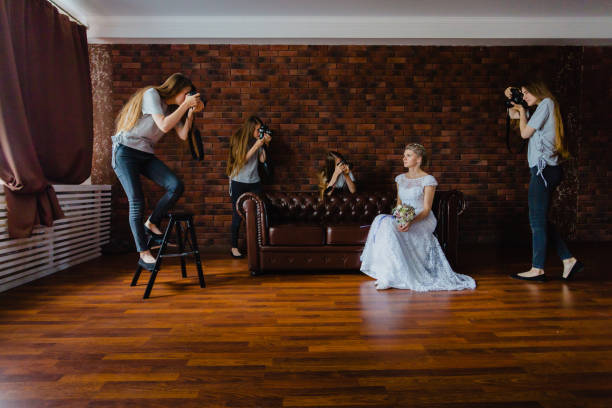 Hallucination of a bride with four photographers stock photo