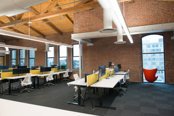 istock Trendy modern open concept loft office space with big windows, natural light and a layout to encourage collaboration, creativity and innovation 850137334