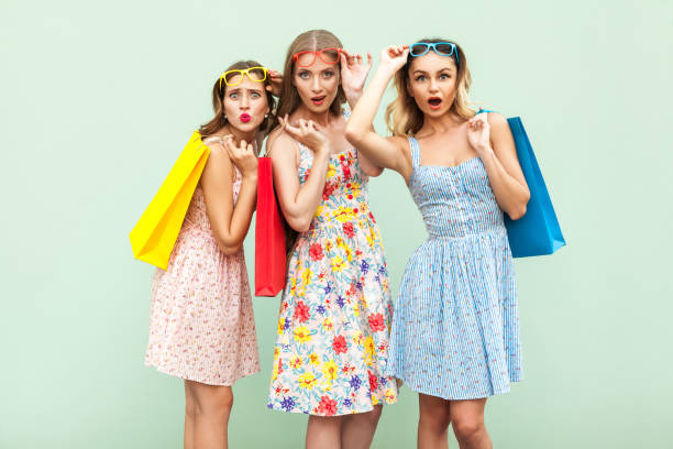 istock Three wonder girls with packages and new clothes. 850137474