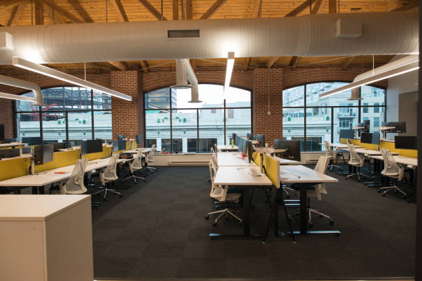 istock Trendy modern open concept loft office space with big windows, natural light and a layout to encourage collaboration, creativity and innovation 850137910