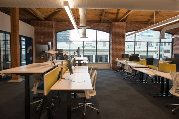 istock Trendy modern open concept loft office space with big windows, natural light and a layout to encourage collaboration, creativity and innovation 850141118