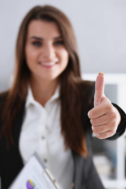 istock Beautiful smiling woman showing OK or approval sign 850142472