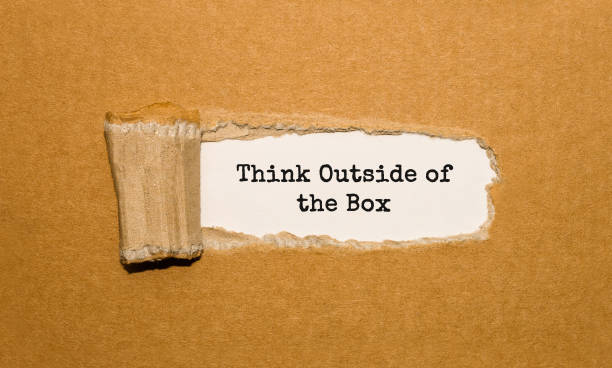 istock The text Think Outside of the Box appearing behind torn brown paper 850145050