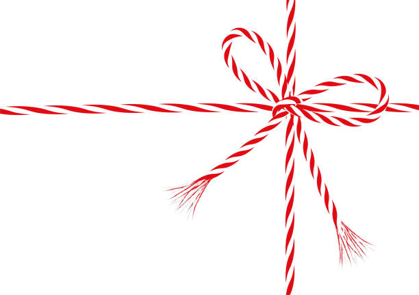 istock Present bow from red-white cord string Bow-knot of red and white twisted cord 850149942
