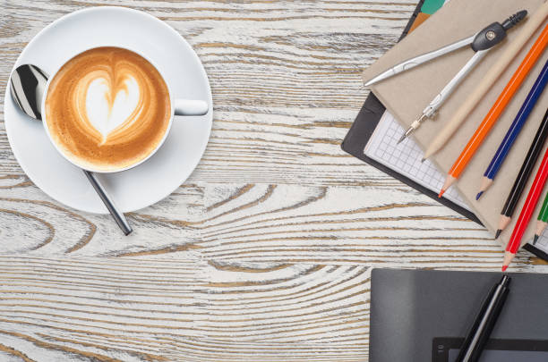 istock notebook with pencils and graphic tablet with coffee 850161178