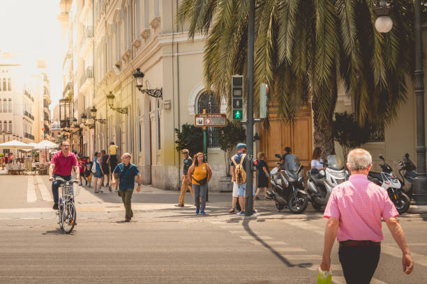 Vanlencia: pedestrians pass through a studded passage with a green light signal