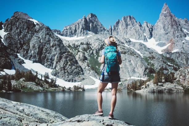 istock Young woman hipster hiking in wilderness 850183062