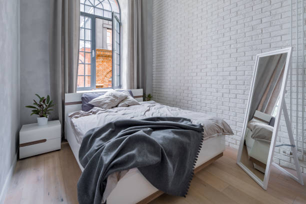 Loft bedroom with brick wall stock photo
