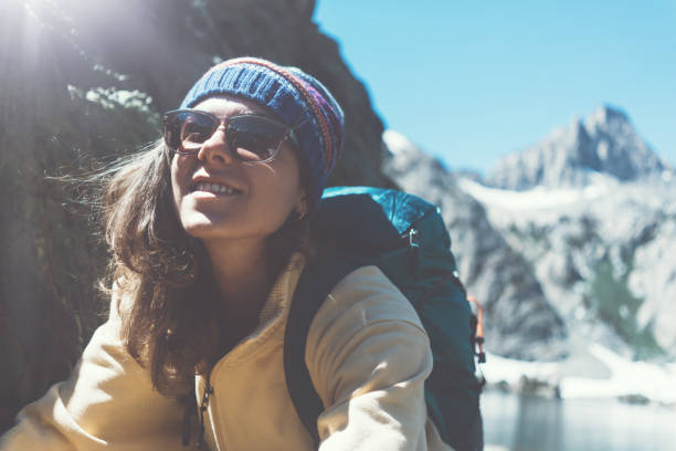 istock Young woman hipster hiking in wilderness with backpack 850190500