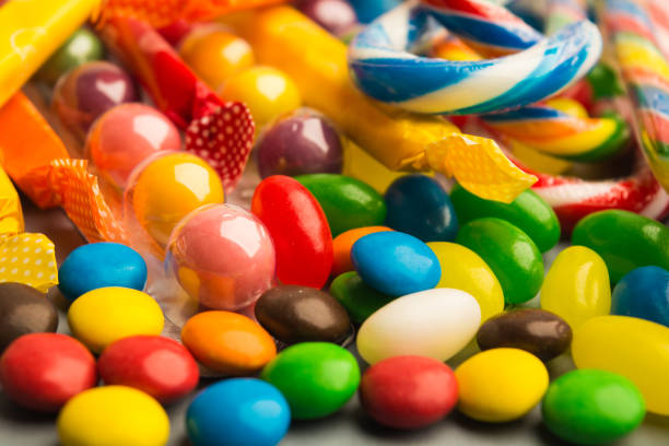 istock Candies on grey background with selective focus in the foreground 850191620