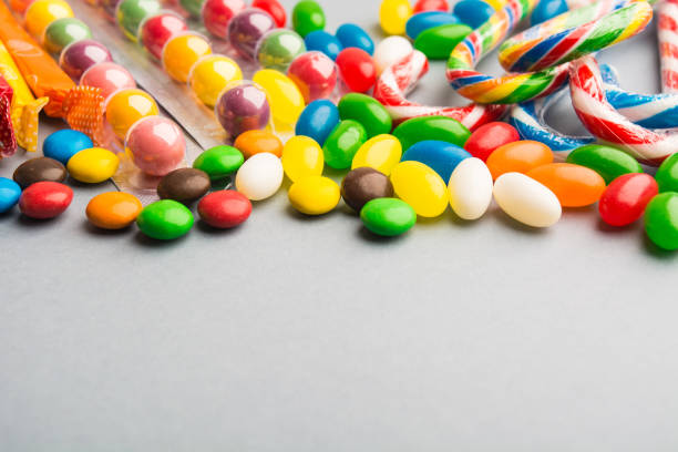 istock Different colorful candies on grey background 850191866