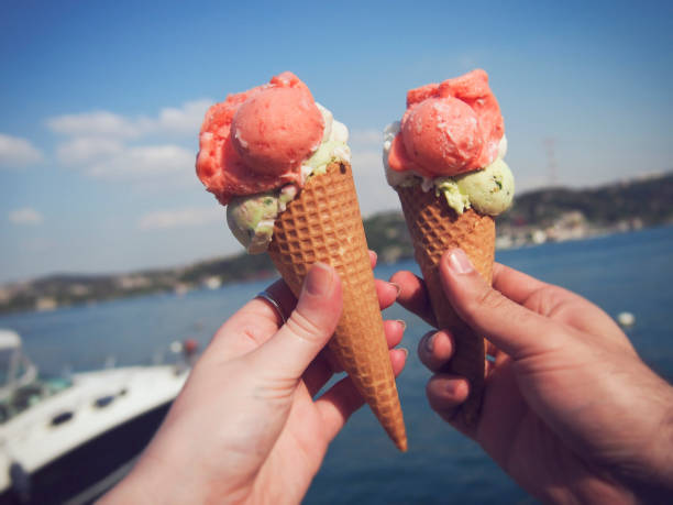 istock Young couple holding ice cream at the sunset. 850195838