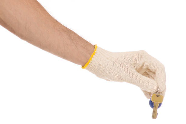 istock Male hands in construction gloves keys 850203456