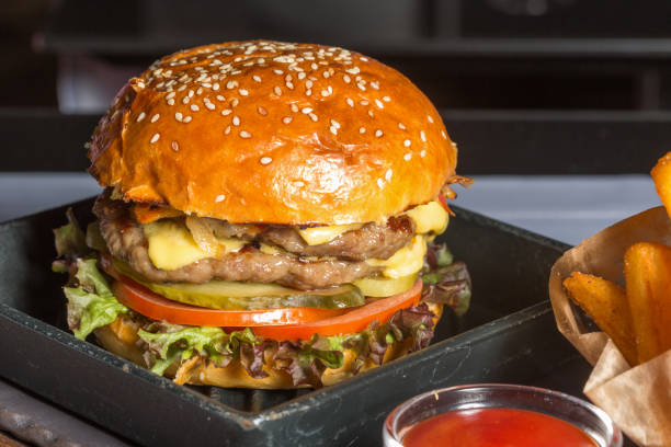 istock Double burger served with French fries 850219370