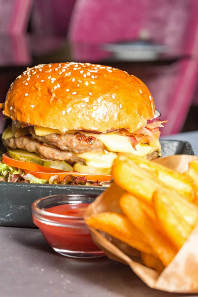 istock Double burger served with French fries 850241896