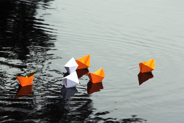 istock Paper boats in still water 850250886