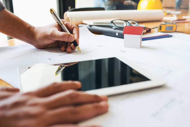 istock Engineer business man hardworking to drawing architect blueprint startup small business for new workplace of his customer for good and strong building design. 850259960