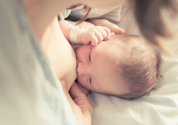istock Newborn baby breastfeeding 850304358