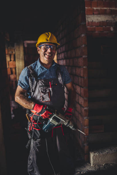 istock Portrait of a man on construction site with drill 850308106