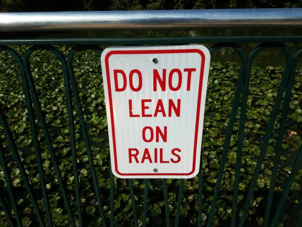 istock do not lean on rails sign with water 850340784