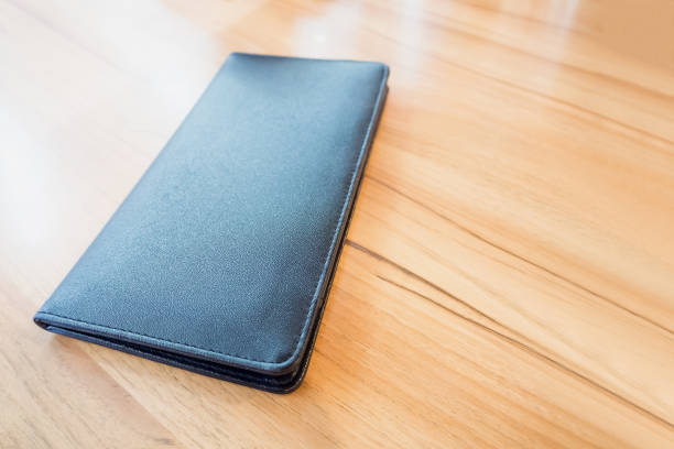 istock black leather restaurant payment billing receipt folder on wood table 850346638