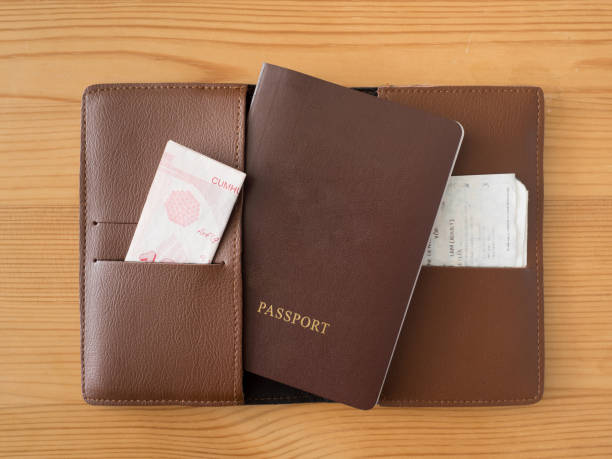 istock Brown passport pocket on wooden table. 850346922