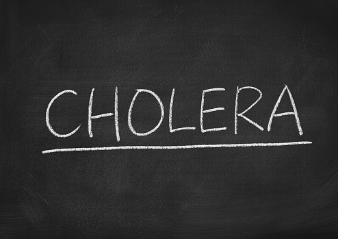 cholera concept word on a blackboard background