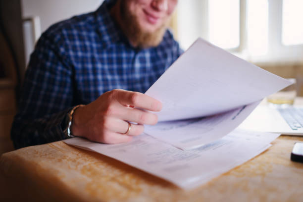 istock Handsome man working at home in the kitchen 850422354