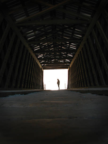 Solitary man at end of tunnel