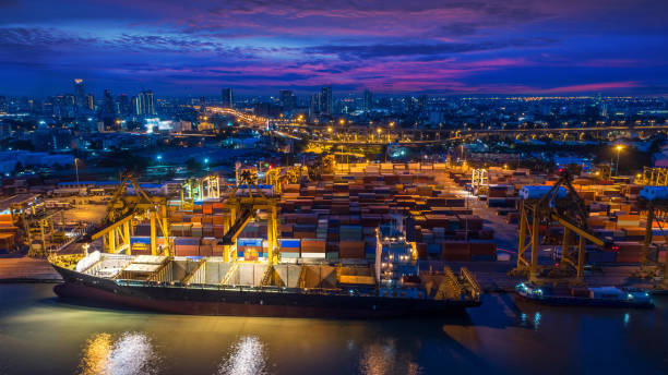 istock Logistics and transportation of Container Cargo ship and Cargo plane with working crane bridge in shipyard 850518632