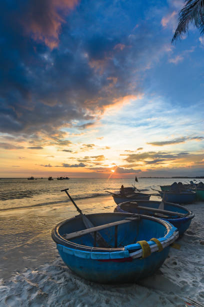 Basket boat in sunset, ke ga, Phan Thiet, Viet Nam Fishing Village, Gold Beach, Indochina, Mui Ne Bay, Pollution basket boat stock pictures, royalty-free photos & images