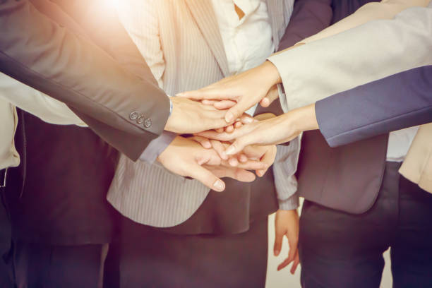 istock Success Teamwork Concept, Business people joining hands city background. 850614332