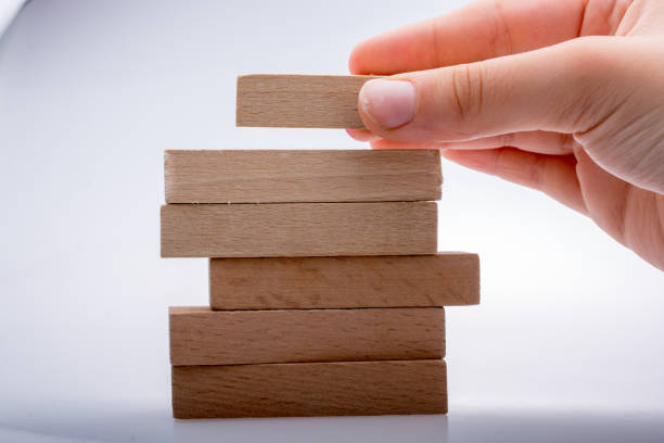 istock Hand holding wooden domino 850623848