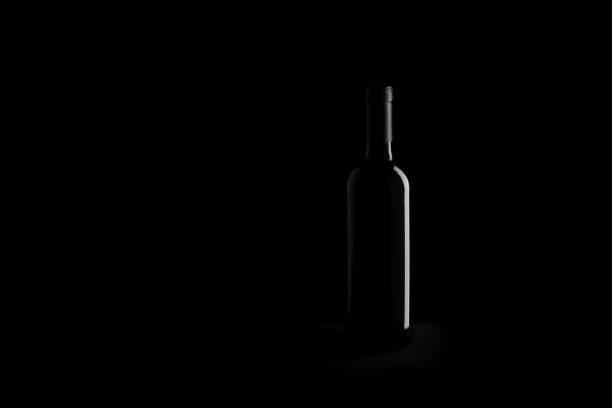 istock wine bottle on black background - black and white photo 850643406