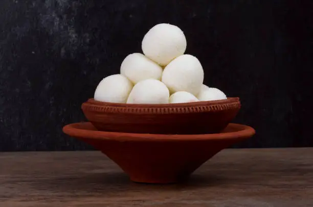 Rasgulla is a syrupy dessert popular in the Indian Festivals and It is made from ball shaped dumplings of chhena and semolina dough, cooked in light syrup made of sugar