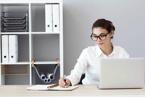 istock Young business woman working in office 850647380